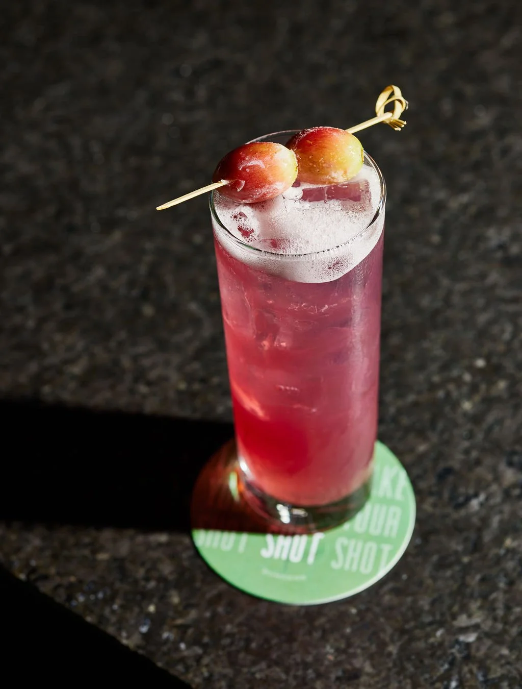 A cocktail on the bar at Bunkers after dark